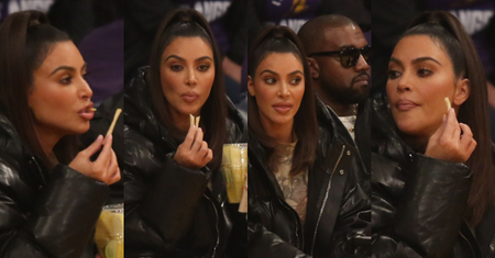 Zblazowana Kim Kardashian zajada frytki na meczu w towarzystwie Kanye Westa (ZDJĘCIA)