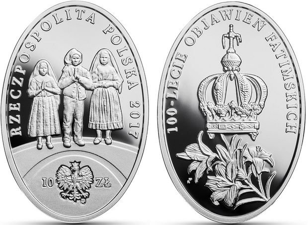 Srebrna moneta kolekcjonerska upamiętniająca 100-lecie objawień fatimskich.