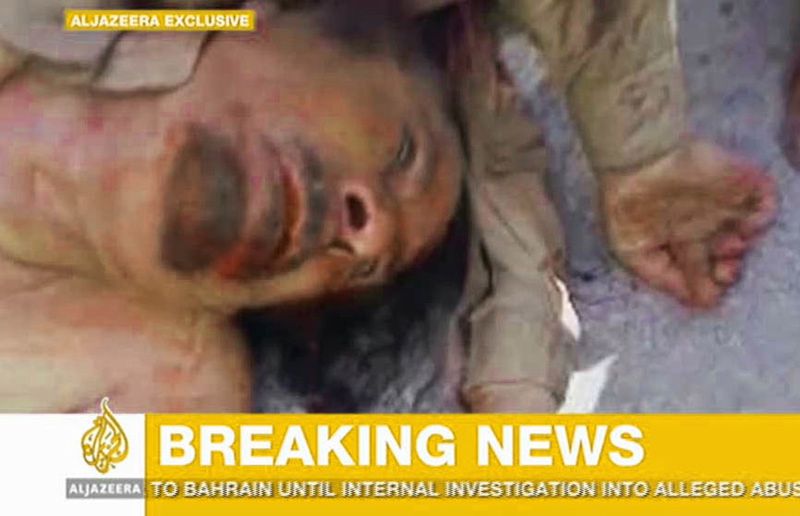 Wstrząsający film Al-Dżaziry: ciągną ciało dyktatora