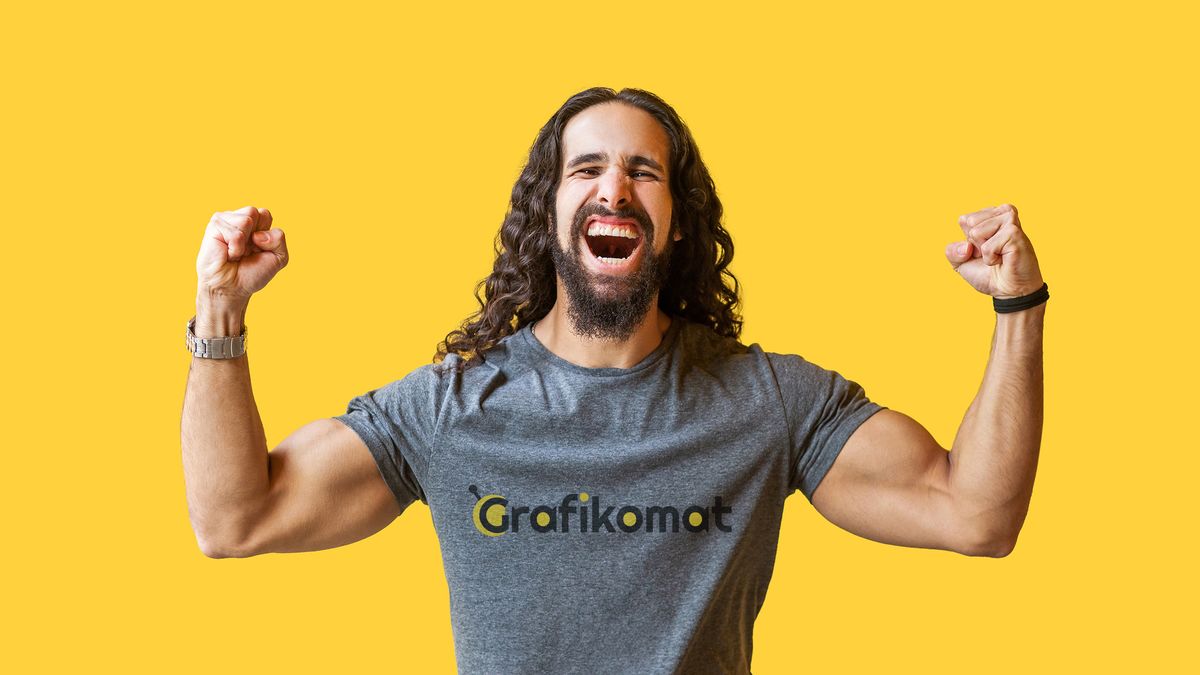 Yes! Portrait of happy rejoicing bearded young man with long curly hair in grey tshirt standing, raised arms and celebrating his victory, screaming . indoor studio shot isolated on yellow background.