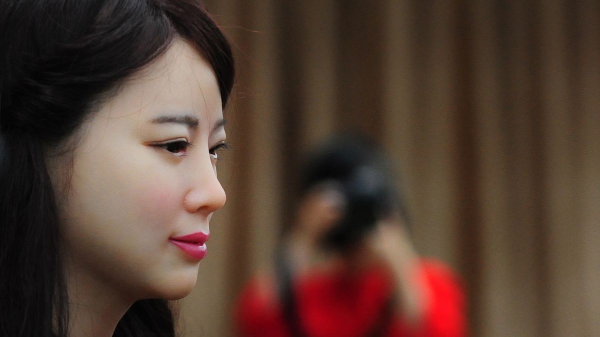 HEFEI, CHINA - APRIL 15: (CHINA OUT) A new realistic-looking robot named \"Jia Jia\" poses for a photo at the campus of the University of Science and Technology of China on April 15, 2016 in Hefei, Anhui Province of China. It took the team three years to research and develop this new-generation interactive robot, which can speak, show micro-expressions, move its lips, and move its body, according to team director Chen Xiaoping. Compared to previous interactive robots, Jia Jia\'s eyeballs roll naturally and its speech is in sync with its lip movements, in addition to her human-like form, Chen said. (Photo by VCG)***_***