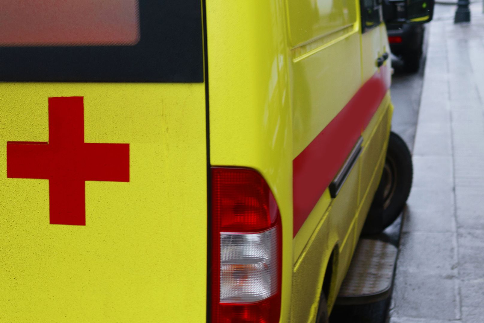 Red cross on yellow ambulance cars