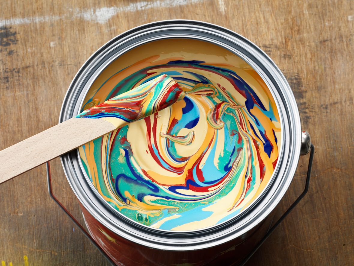 Color tin can on old wood background. Redecoration and renovation concept. 