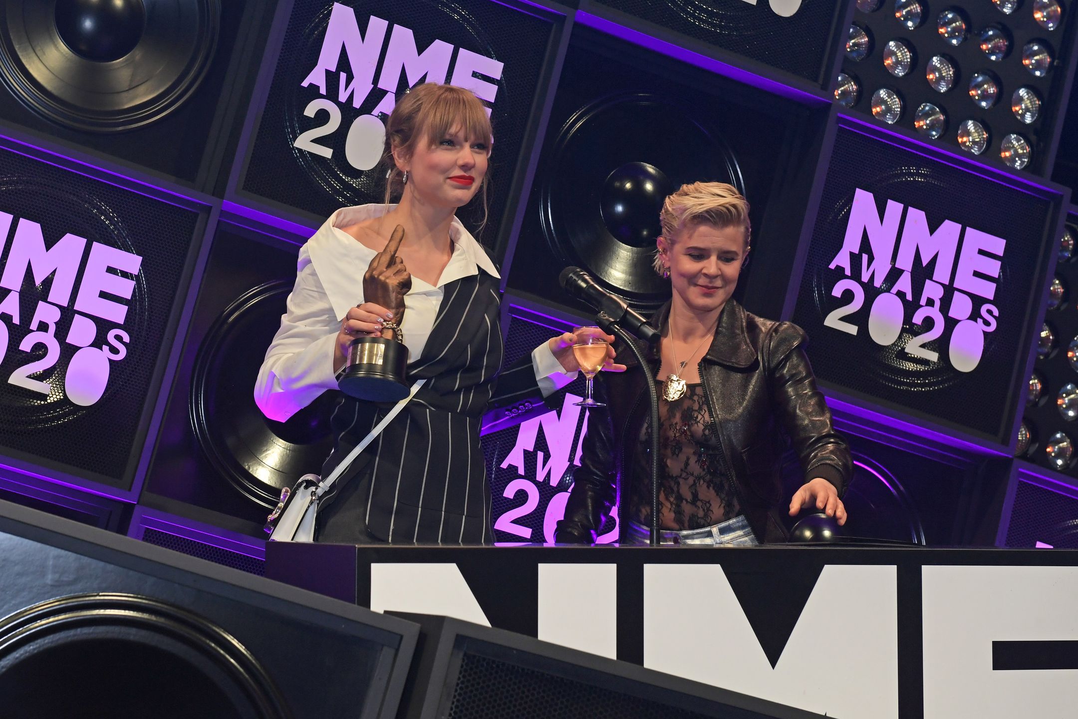 LONDON, ENGLAND - FEBRUARY 12:  Taylor Swift, winner of the award for Best Solo Act In The World, and Robyn, winner of Songwriter Of The Dedade, attend The NME Awards 2020 at the O2 Academy Brixton on February 12, 2020 in London, England.  (Photo by David M. Benett/Dave Benett/Getty Images) 