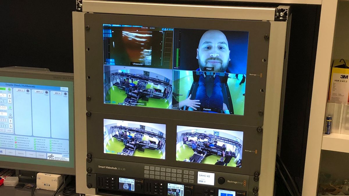 Rear view of woman stretching in her bed 