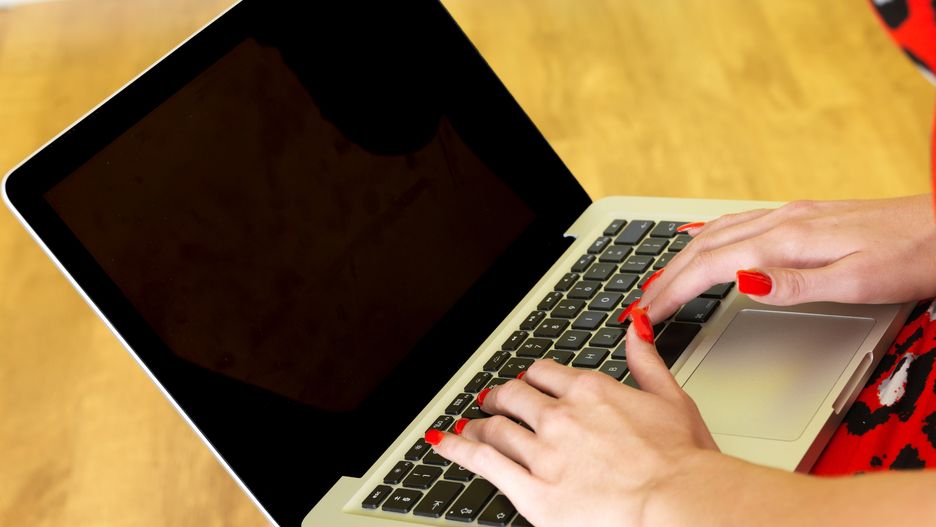 Woman Using a Laptop Computer