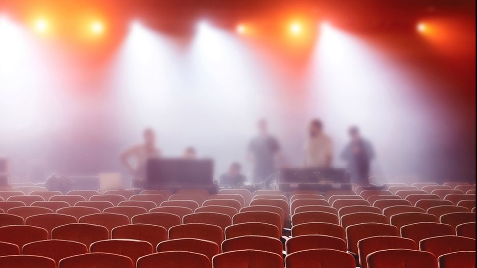 The auditorium before the concert. Empty chairs.