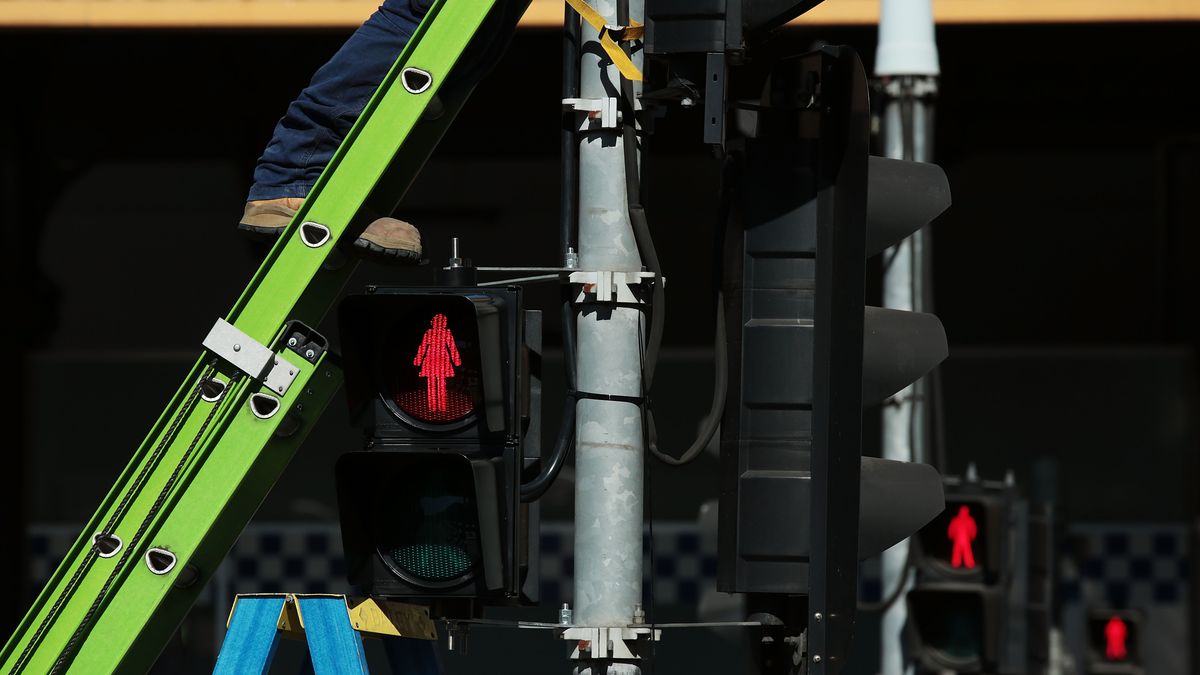 Female traffic light signals are installed at the intersection of Swanston and Flinders streets on March 7, 2017 in Melbourne, Australia. Ten female pedestrian crossing signals are being installed as part of a 12-month trial in an aim to address unconscious gender bias. The Committee for Melbourne, a non-profit organisation comprising more than 120 Melbourne business and community groups, is behind the move.