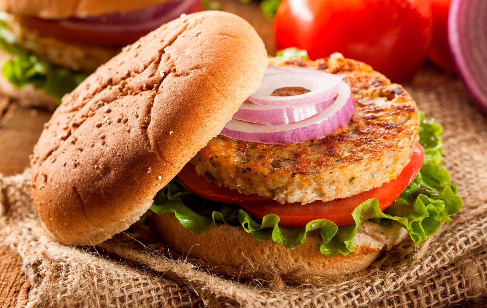23681304 - organic grilled black bean burger with tomato and lettuce 
