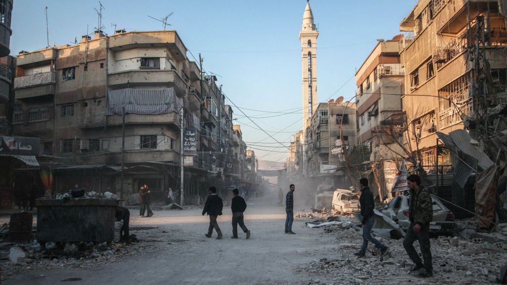 DOUMA, DAMASCUS, SYRIA - 2018/02/07: Buildings seen being damaged by the air strike.The Syrian regime forces carried our air strike in the rebel held town of Douma. 14 anti government rebels has reported dead by this attack. (Photo by Muhmmad Al-Najjar/SOPA Images/LightRocket via Getty Images)