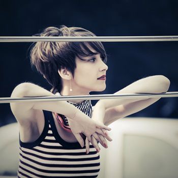 Sad young fashion woman leaning on handrail outdoor 