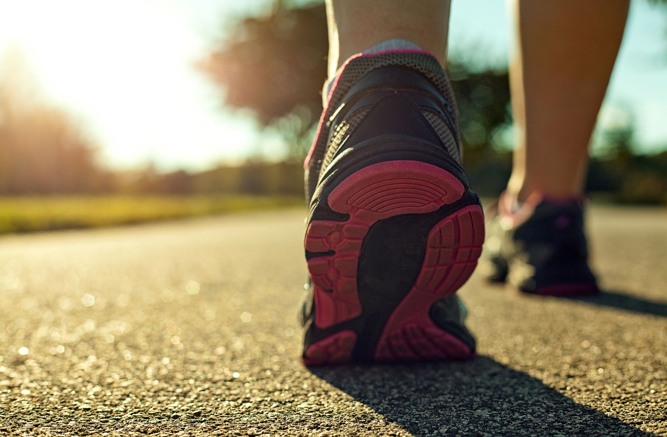 Close up of a woman running on a road. 